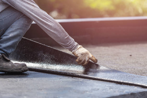 Professional Basement Waterproofing technician working in Dundee, MI